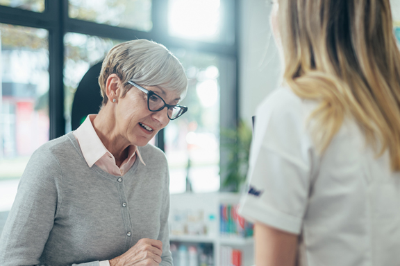 Lady talking to a pharmacist